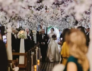 Our stunning White Cherry Blossom trees draped with flowing fabric create a magical atmosphere, transporting you and your guests to a fairytale wedding. The white blossoms, combined with the soft draping fabric, create a romantic and dreamy ambiance, making the aisle of Claddagh Church Galway the perfect place to say "I do."