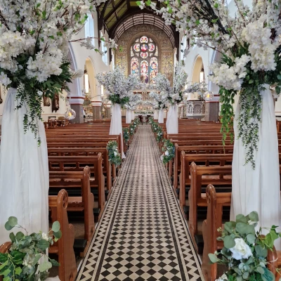 The Claddagh Church in Galway is a picturesque and romantic setting for couples to exchange their wedding vows, and we were thrilled to have the opportunity to decorate it with our beautiful cherry blossom package. The white cherry blossom centerpieces added an ethereal touch of softness and beauty to the church, and they perfectly complemented the natural charm and elegance of the Claddagh Church. At Aisle Love You, we offer a wide range of bespoke wedding decor services that help make every wedding truly unforgettable. We know that the right decor is essential to creating the perfect ambiance and atmosphere for your wedding day. That's why we're passionate about working closely with each couple to bring their unique visions to life, creating bespoke decor offerings that are tailored to their individual tastes and styles.